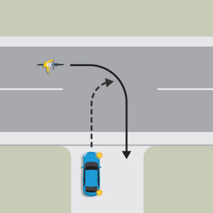 A blue car is indicating left to turn onto the continuing road from a drive way. A bicycle is approaching from the left and wants to turn into the driveway. The blue car must give way to the cyclist.