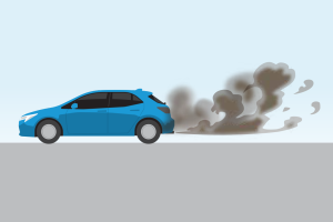 Blue car driving with dark smoke coming out exhaust.