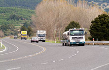 Vehicles passing a truck on a passing lane